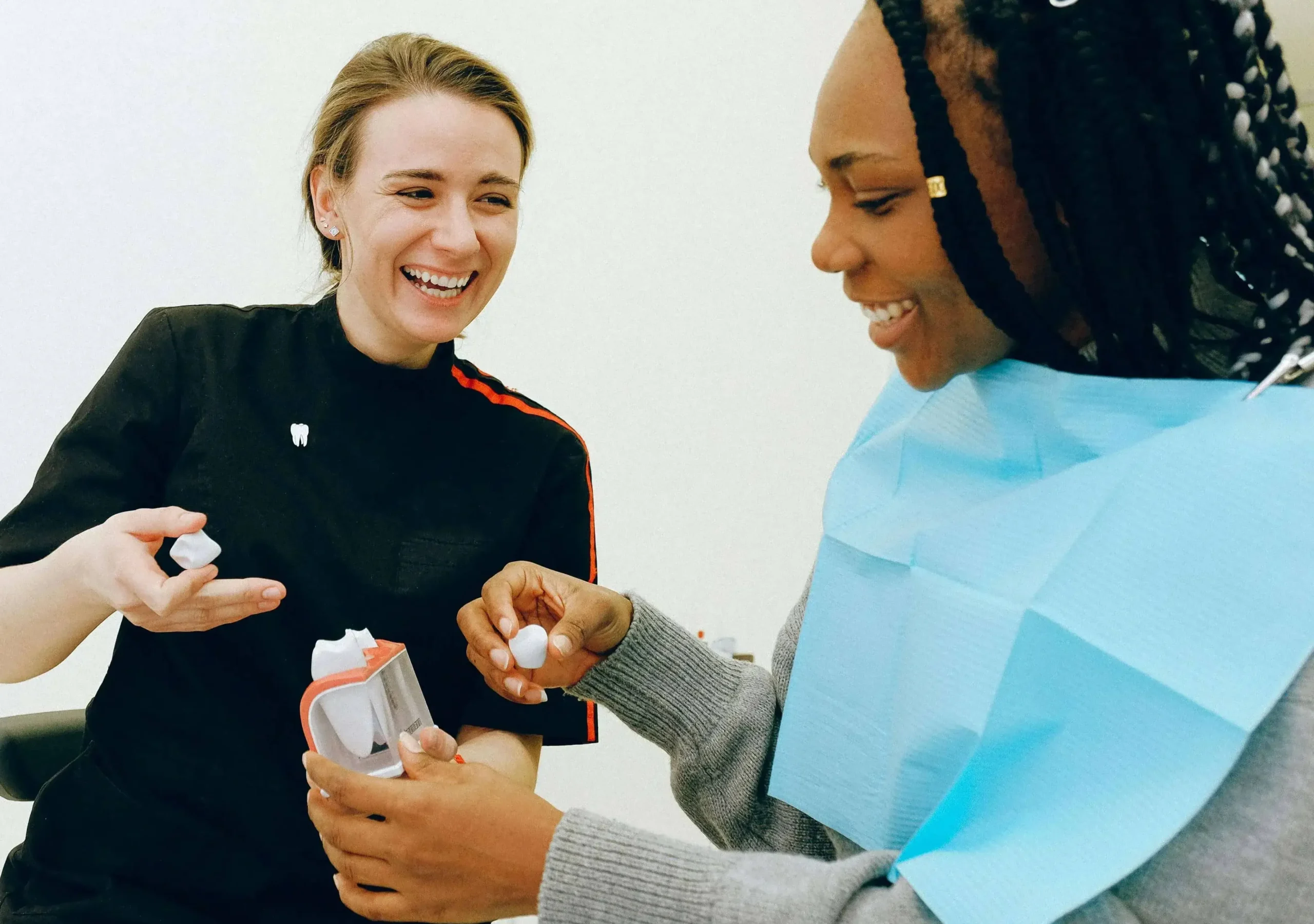 Women looking at teeth Chinook Mall Family Dental clinic dental Fillings vs Crowns: Which One Do You Need?