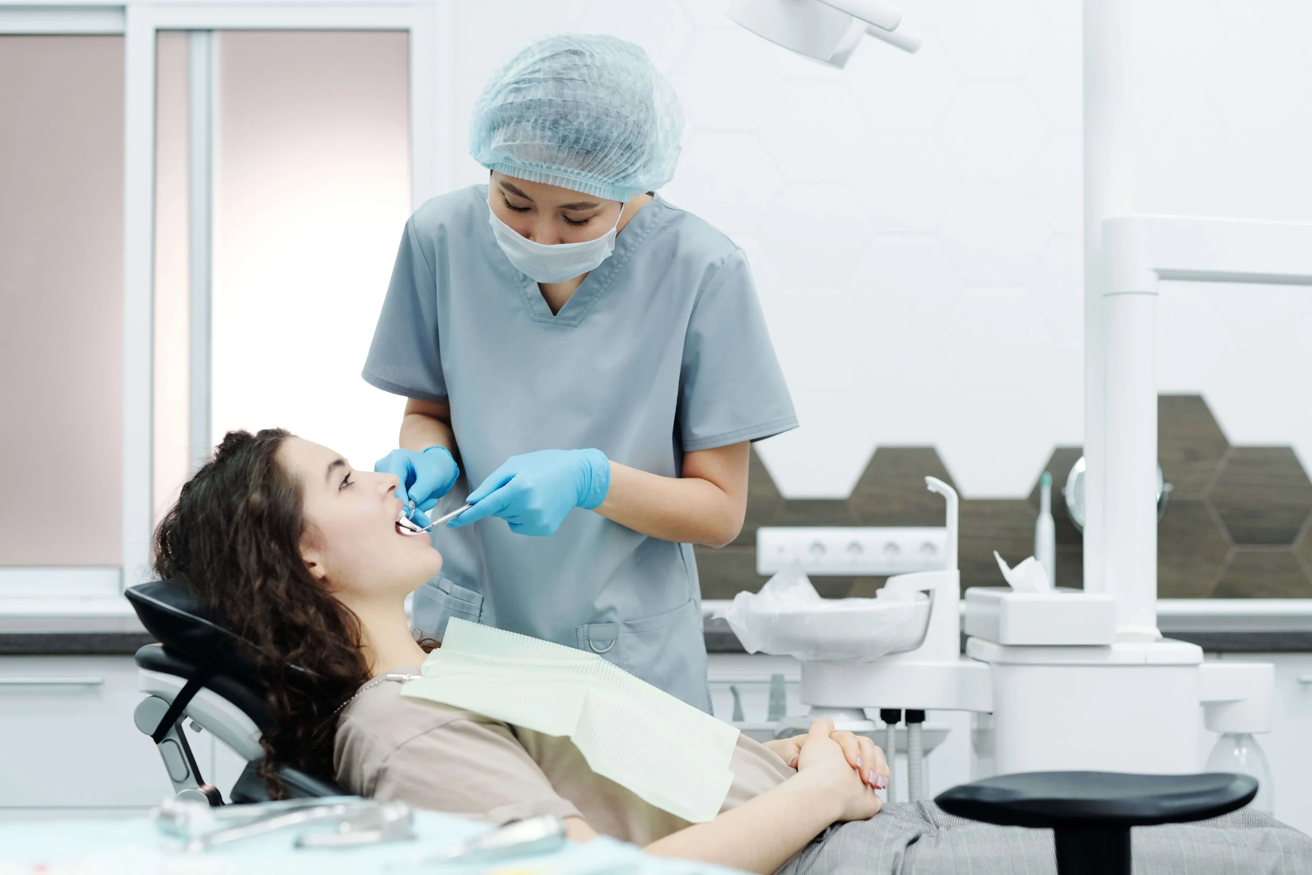 patient at the dentist for a tooth extraction Chinook Mall Family Dental